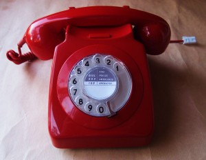 old fashioned red rotary dial phone